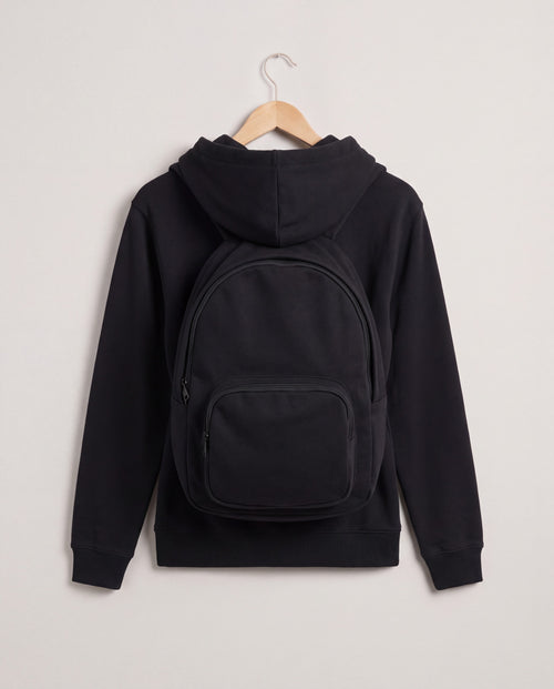 PackHoodie in Black, back view with built-in backpack pouch